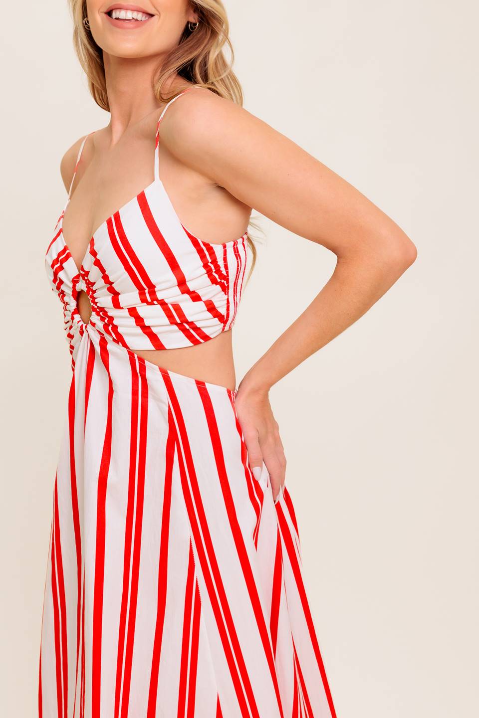A striped woven ankle dress featuring cami top with center O ring, wide skirt and smocked back bodice.