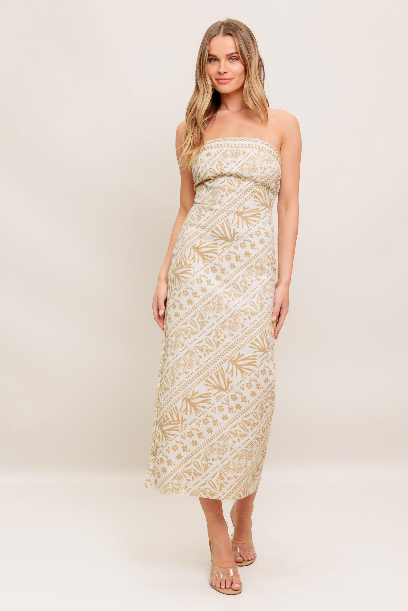 A printed woven midi dress featuring tube top, H line skirt and back zipper closure