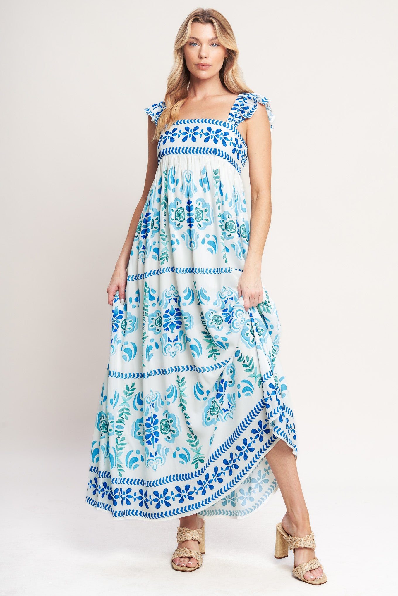 A printed woven maxi dress featuring square neckline, short flutter sleeve and smocked back bodice
Details:
Self: 100% Polyester
Lining: 100% Polyester
Size & Fit
-Model is 5`8" And Wearing Size Small
-Measurements Taken From Size Small
-Approx. Length: 56"