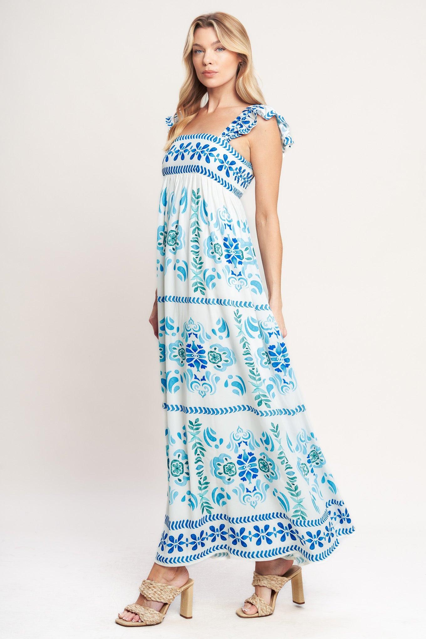 A printed woven maxi dress featuring square neckline, short flutter sleeve and smocked back bodice
Details:
Self: 100% Polyester
Lining: 100% Polyester
Size & Fit
-Model is 5`8" And Wearing Size Small
-Measurements Taken From Size Small
-Approx. Length: 56"