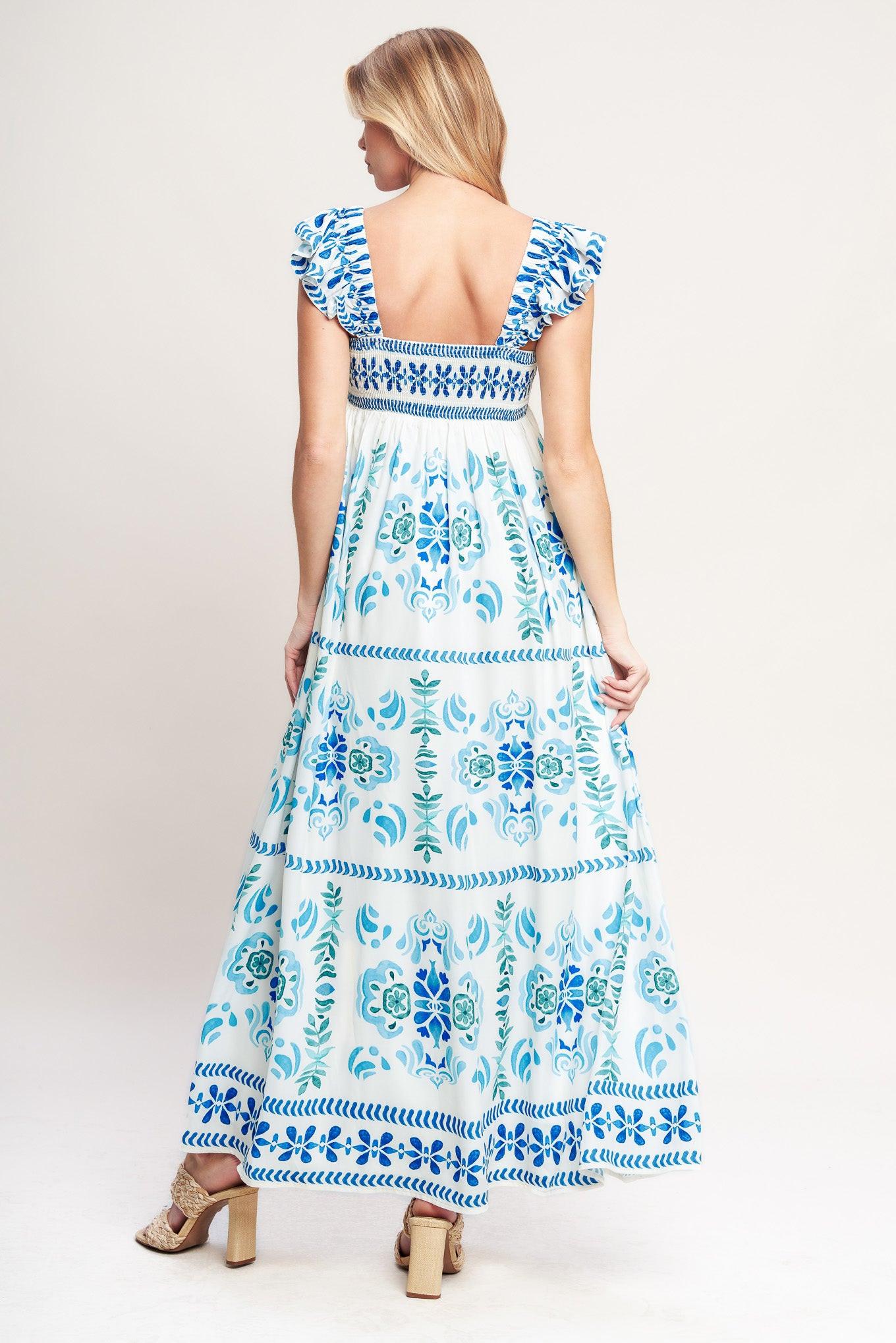 A printed woven maxi dress featuring square neckline, short flutter sleeve and smocked back bodice
Details:
Self: 100% Polyester
Lining: 100% Polyester
Size & Fit
-Model is 5`8" And Wearing Size Small
-Measurements Taken From Size Small
-Approx. Length: 56"