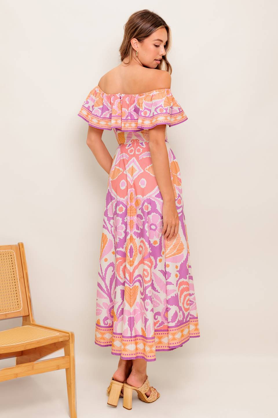A printed woven midi dress featuring off shoulder neckline, flounce, circle skirt and back zipper closure
