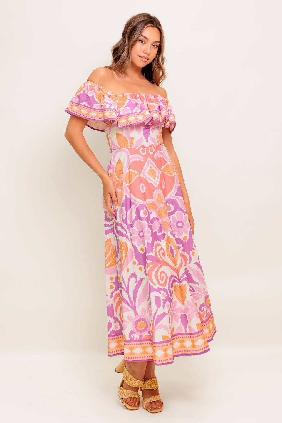 A printed woven midi dress featuring off shoulder neckline, flounce, circle skirt and back zipper closure