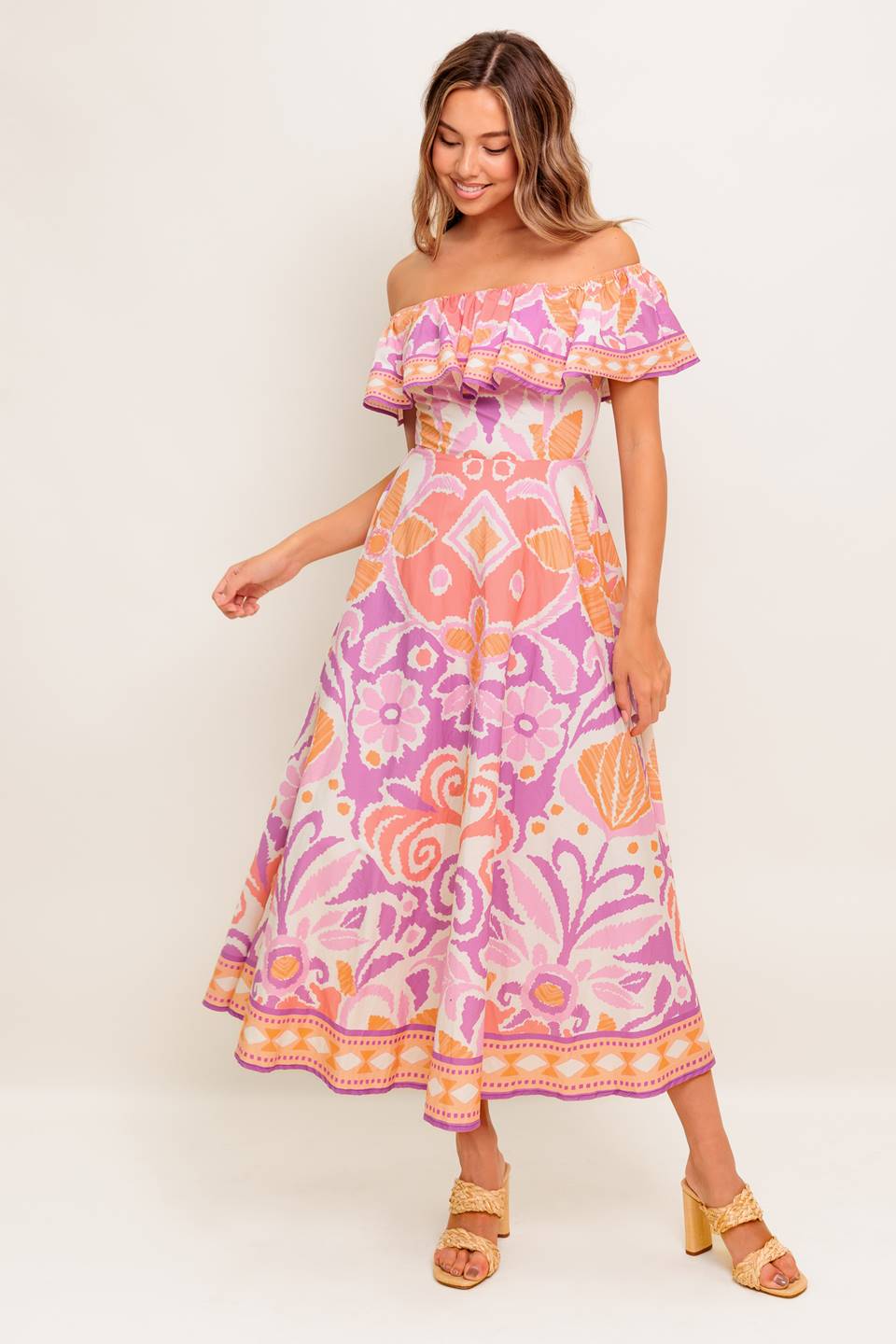 A printed woven midi dress featuring off shoulder neckline, flounce, circle skirt and back zipper closure