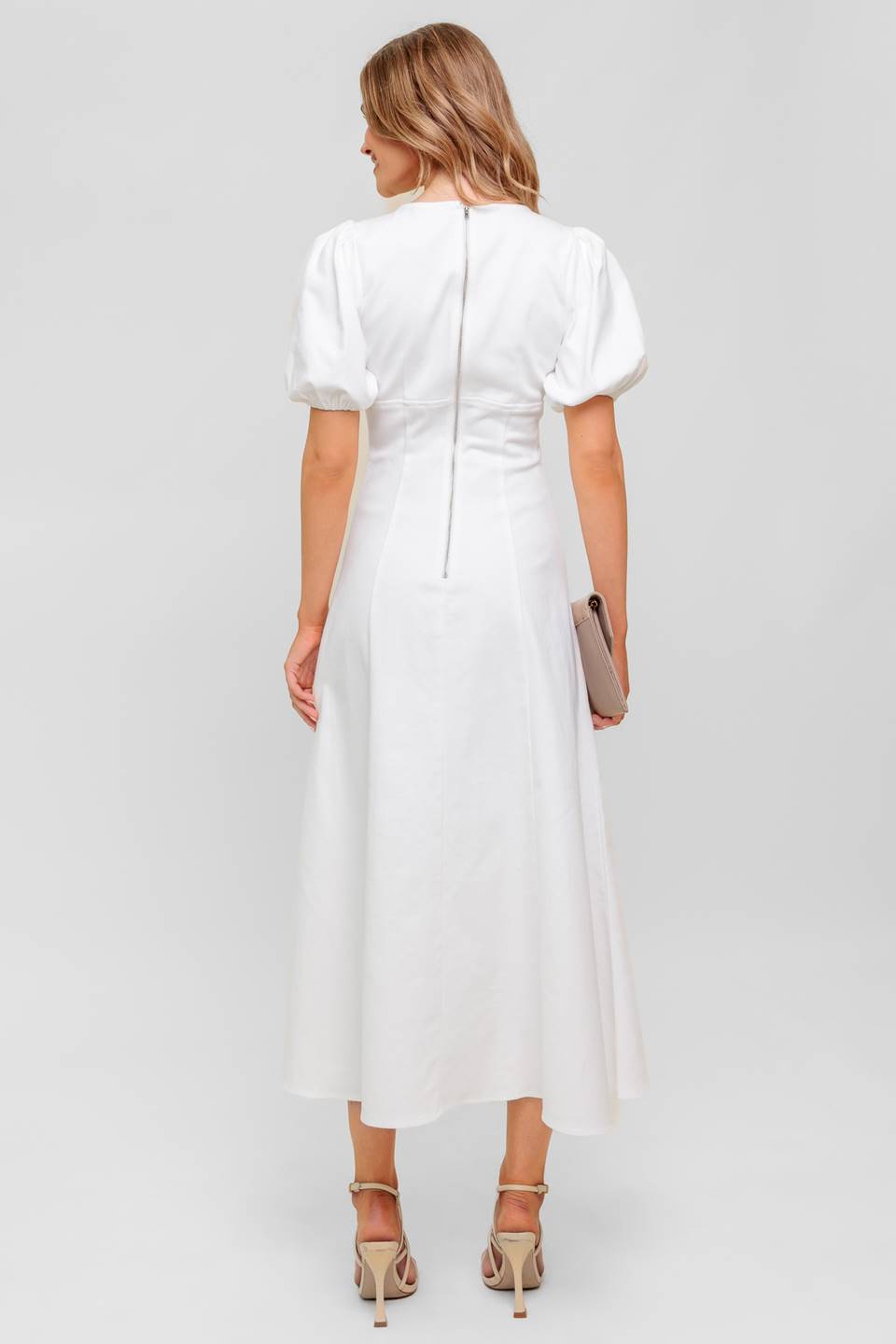 A printed woven midi dress featuring strapless, shirred bodice, full skirt and smock and zipper back closure.