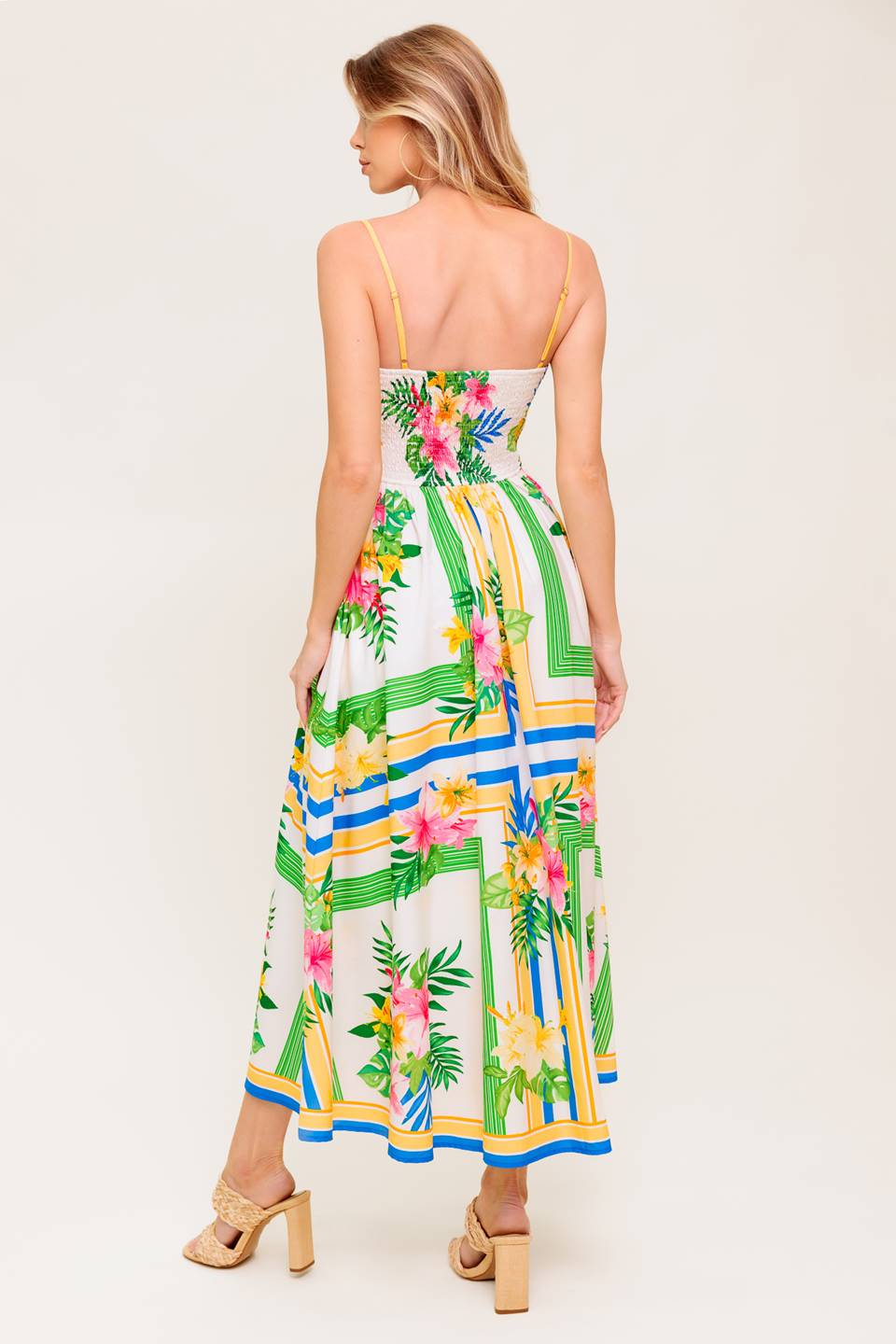 A printed woven midi dress featuring straight neckline, straps, full skirt and smocked back bodice.
