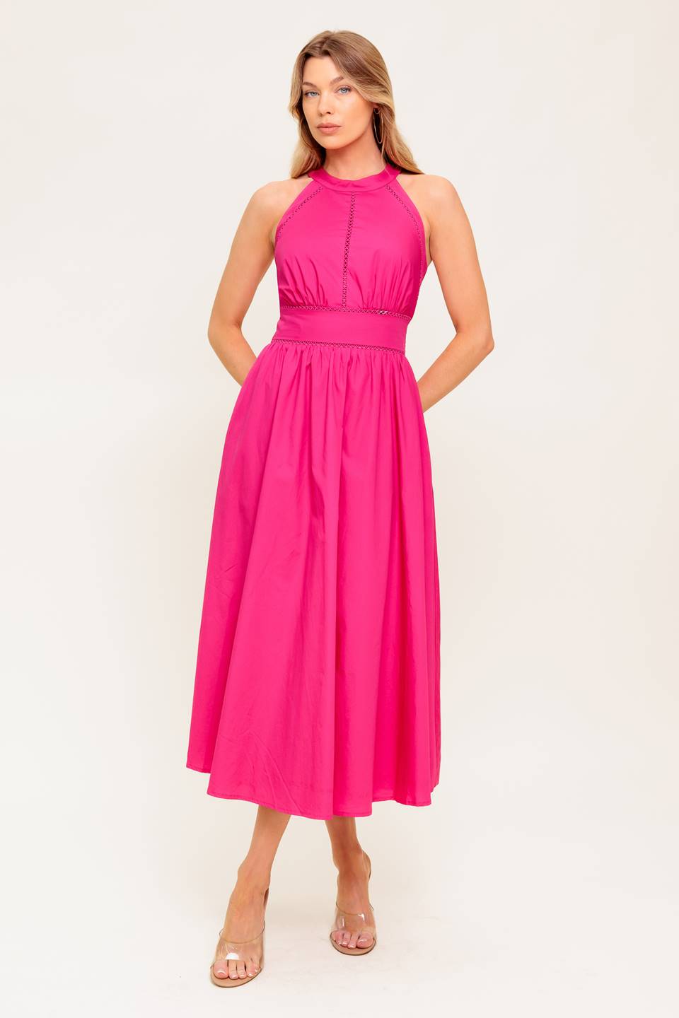 A solid hot pink woven midi dress featuring halter neckline, lace inset detail, smocked back waistband and bare back with button/tie closure.