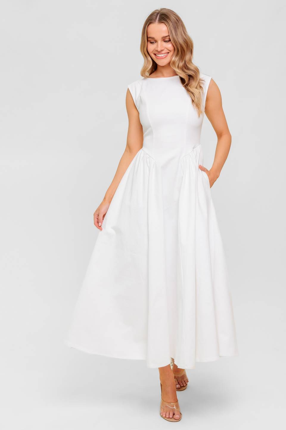 A solid woven midi dress featuring wide neckline, sleeveless, full skirt with U back and zipper closure
