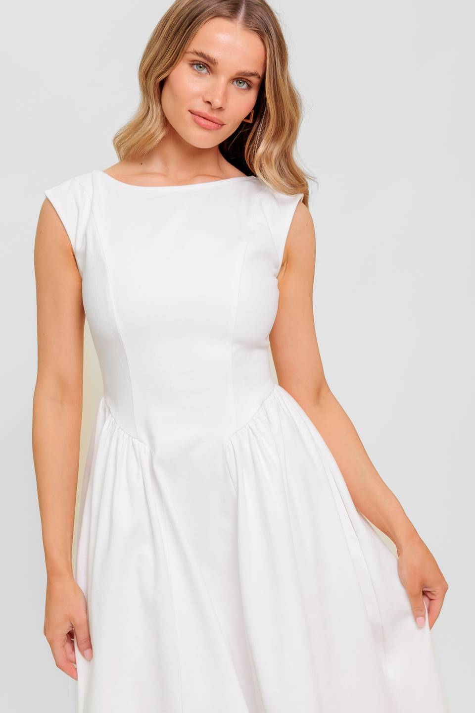 A solid woven midi dress featuring wide neckline, sleeveless, full skirt with U back and zipper closure