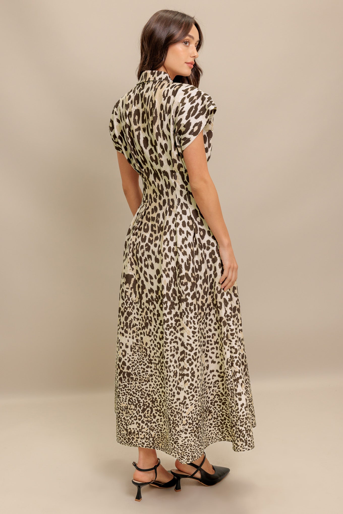 A printed woven midi dress featuring collar, dropped shoulder, front button down, fitted waist and full skirt