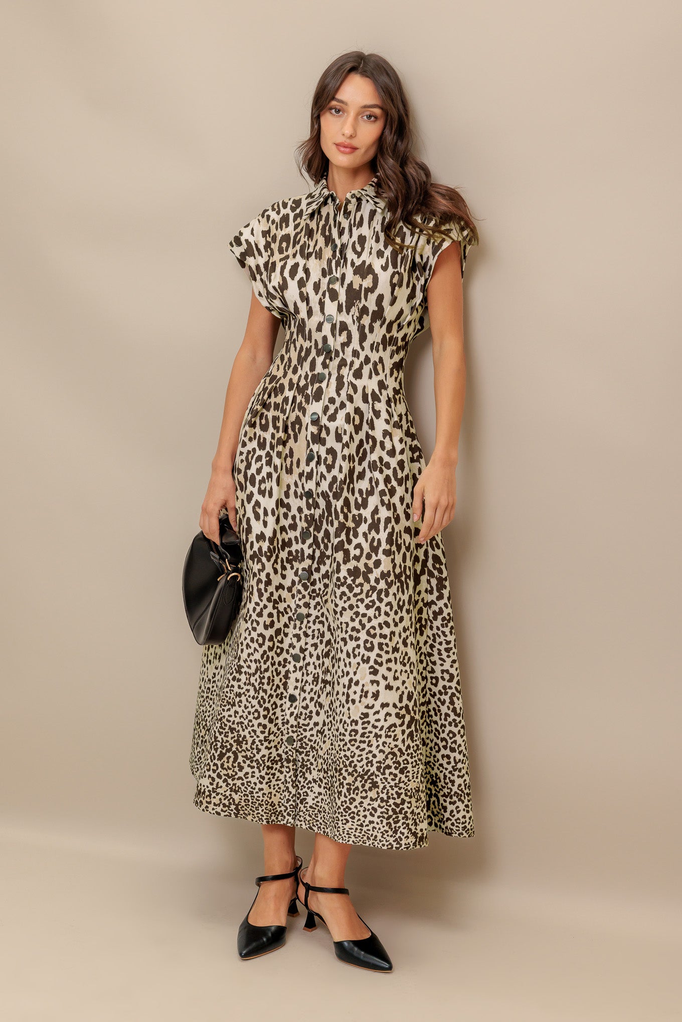 A printed woven midi dress featuring collar, dropped shoulder, front button down, fitted waist and full skirt