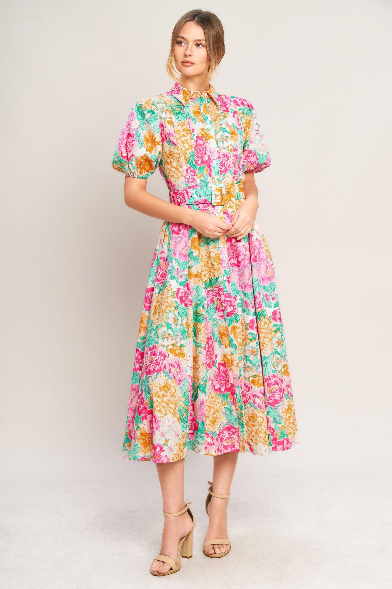 Woman wearing a colorful floral dress on a white background
