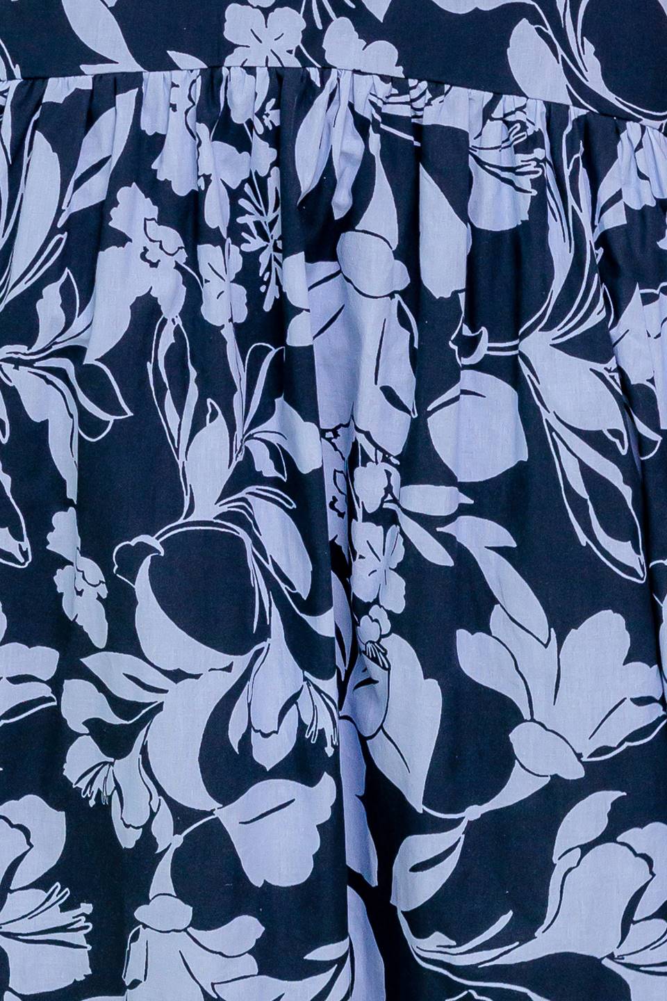 A printed woven midi dress featuring strapless, drop waist, full skirt and back zipper closure.