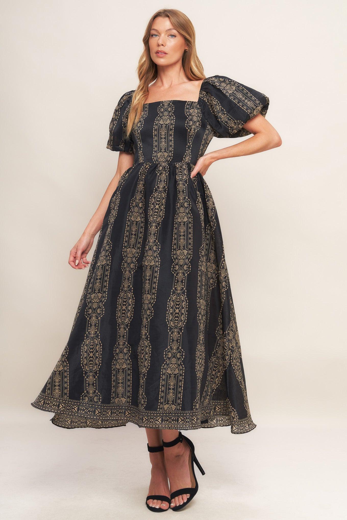 A printed woven midi dress featuring square neckline, short puff sleeve, full skirt and back zipper closure