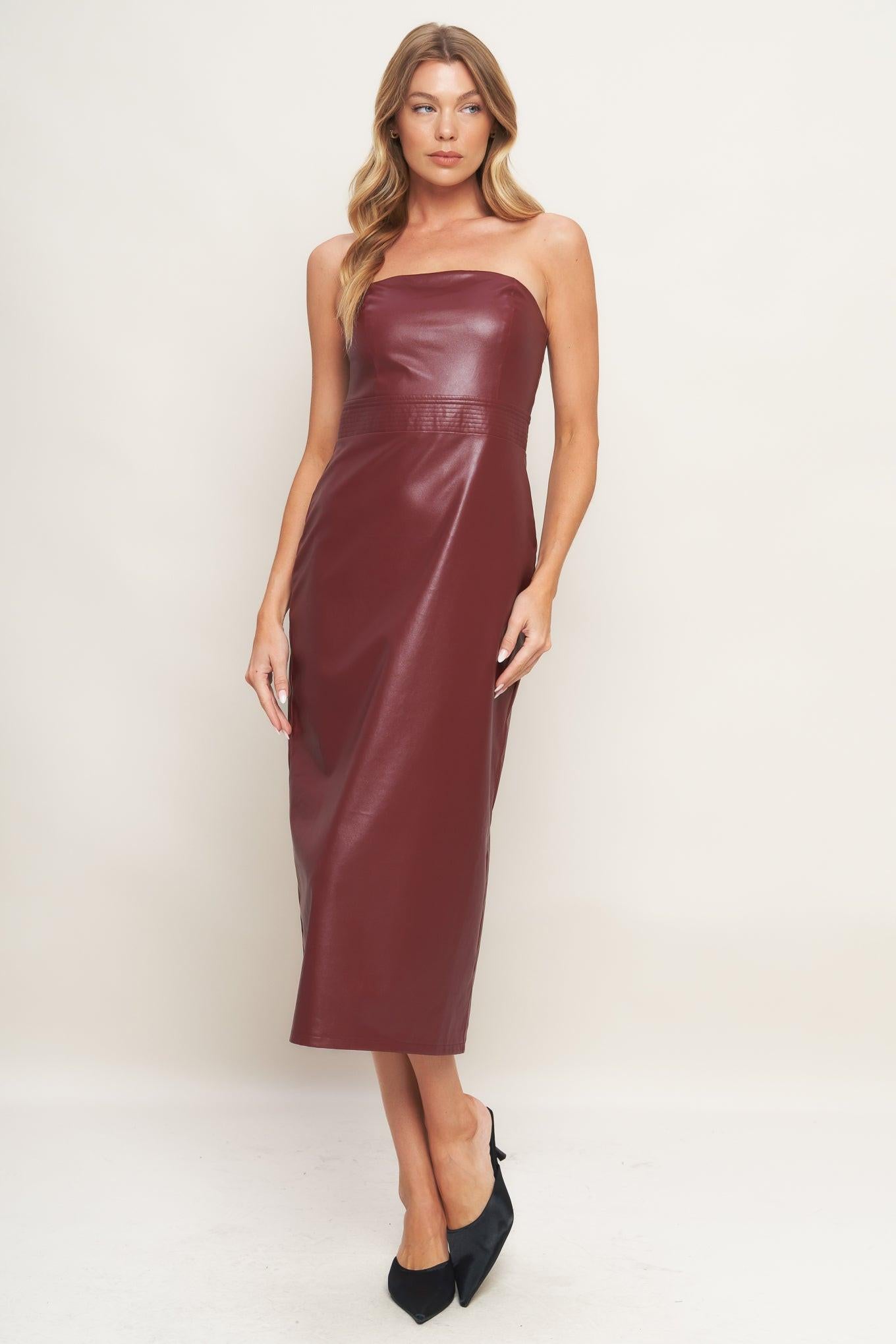 A faux leather midi dress featuring wide neckline, sleeveless, pencil skirt, back slit and back zipper closure