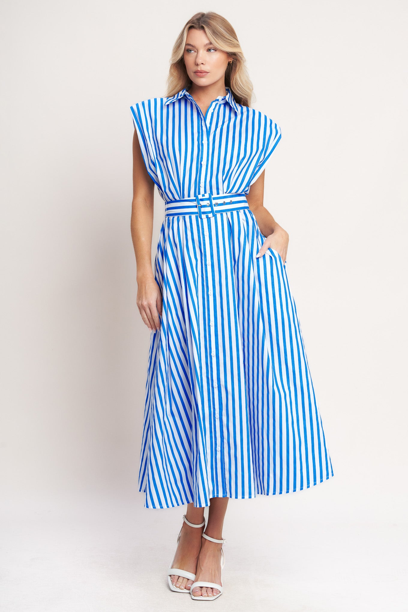 A striped woven midi dress featuring collar, short sleeve, front button down and self belt
Details:
Self : 100% Cotton
Size & Fit
- Model is 5`8" And Wearing Size Small
- Measurements Taken From Size Small
- Approx. Length: 54"