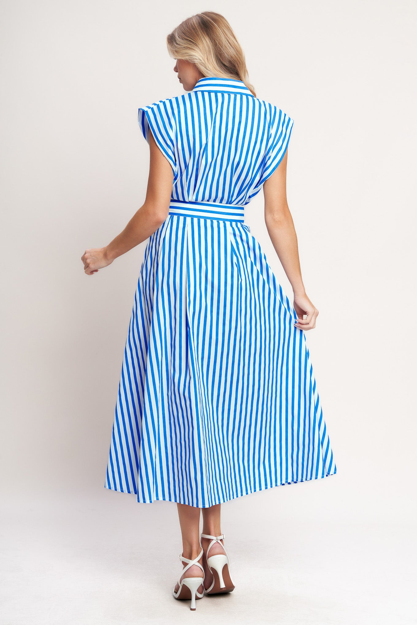 A striped woven midi dress featuring collar, short sleeve, front button down and self belt
Details:
Self : 100% Cotton
Size & Fit
- Model is 5`8" And Wearing Size Small
- Measurements Taken From Size Small
- Approx. Length: 54"