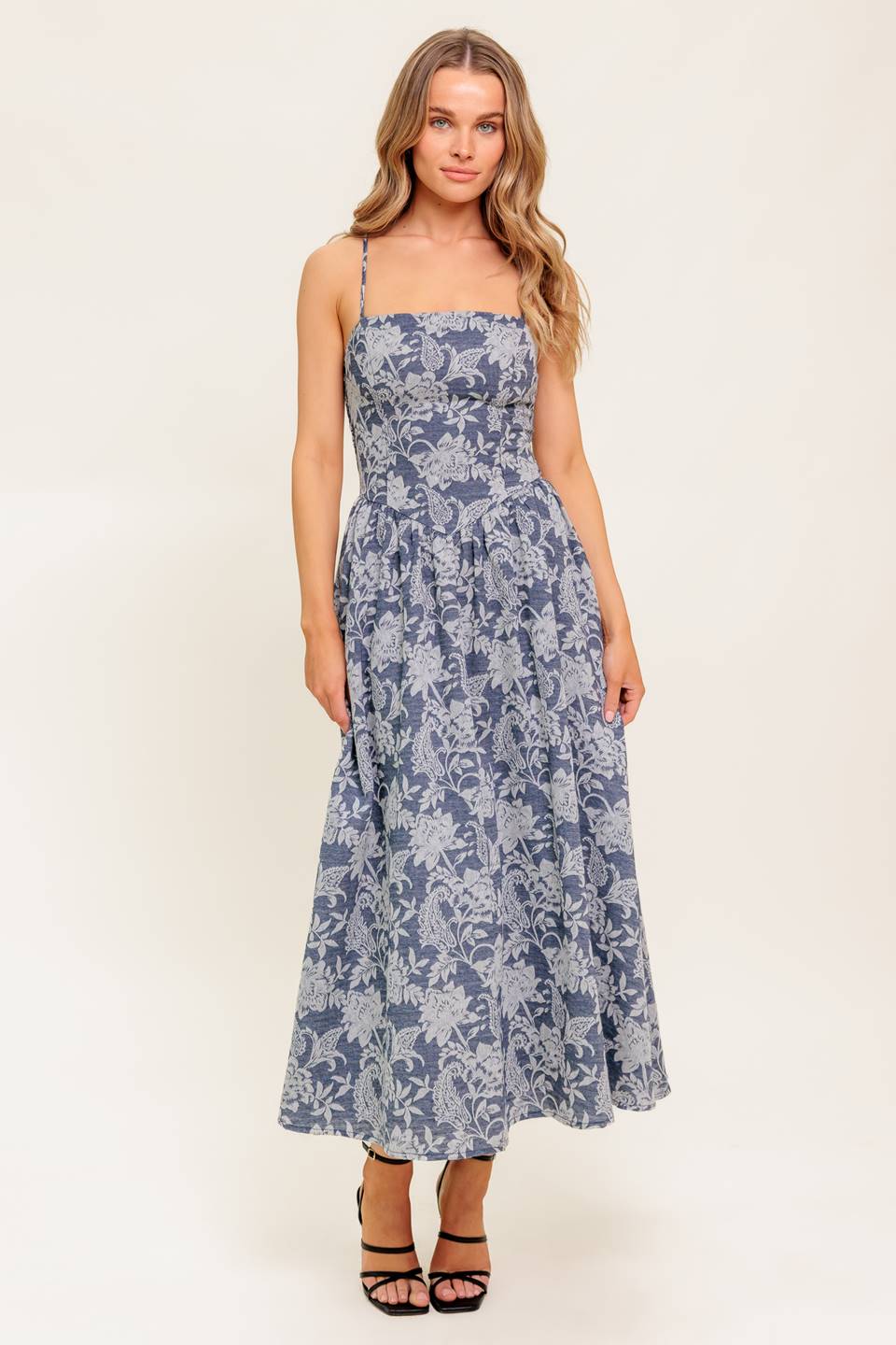 A jacquard woven midi dress featuring straight neckline, straps, full skirt and smocked back bodice.