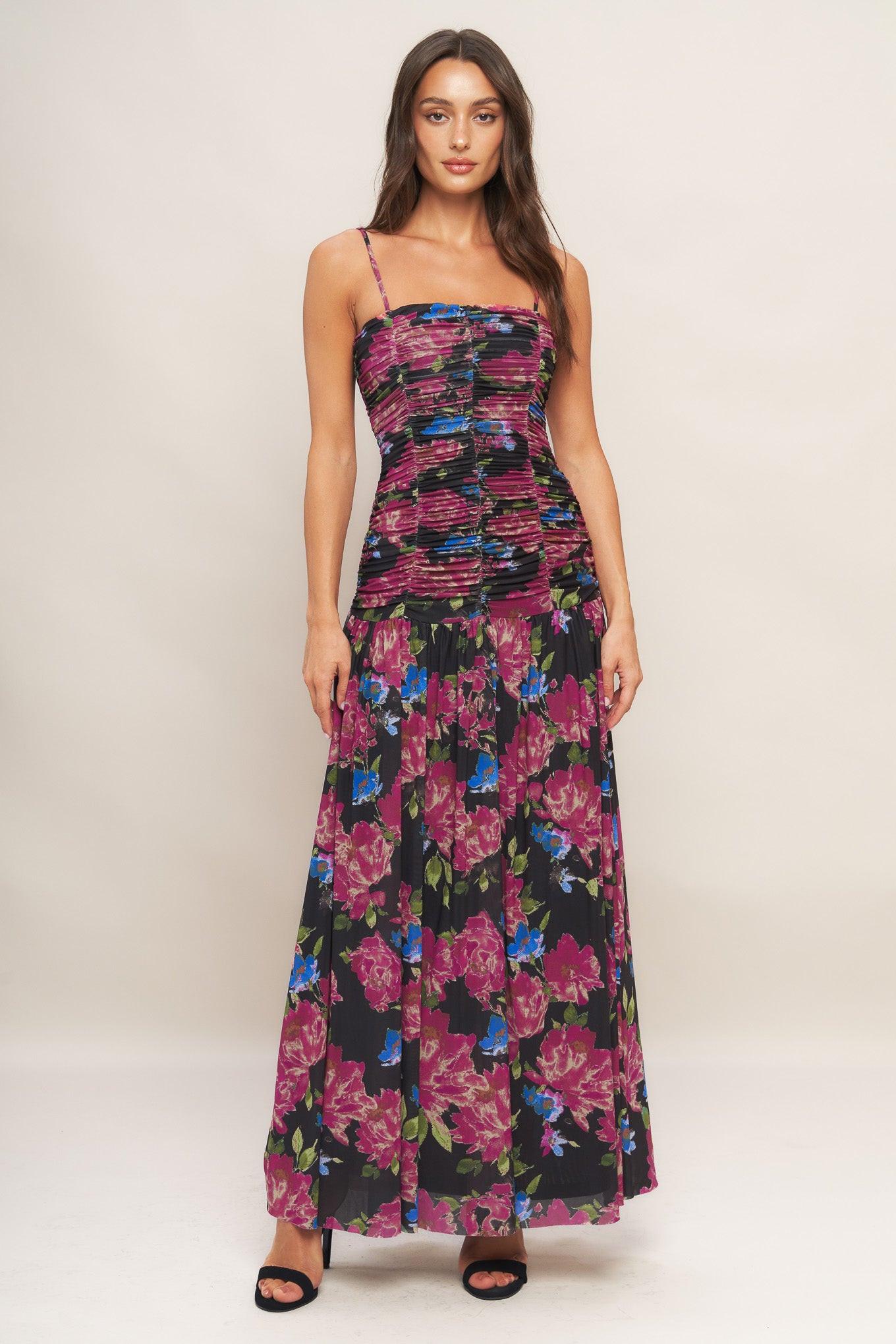 A printed power mesh maxi dress featuring straight neckline, straps, side shirring and back zipper closure