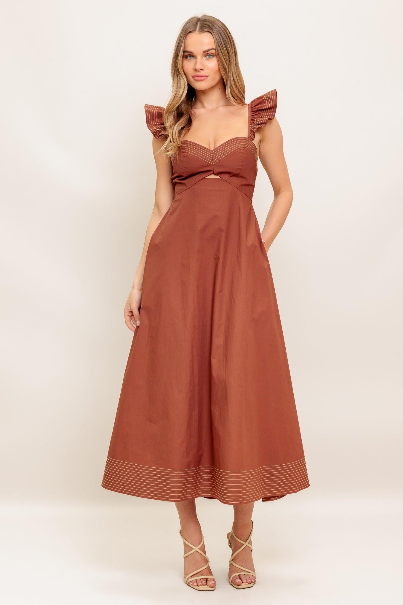 A solid woven midi dress featuring sweetheart neckline, flutter sleeve, center front cut out, circle skirt and smocked back bodice