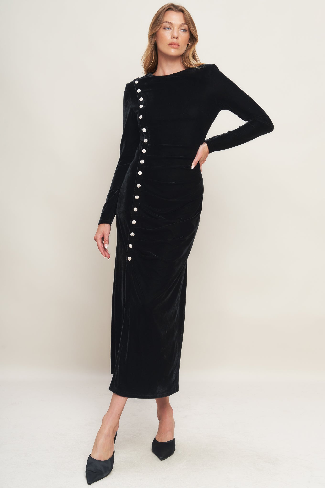 A solid velvet midi dress featuring round neckline long sleeve, side pearl button down and back zipper closure