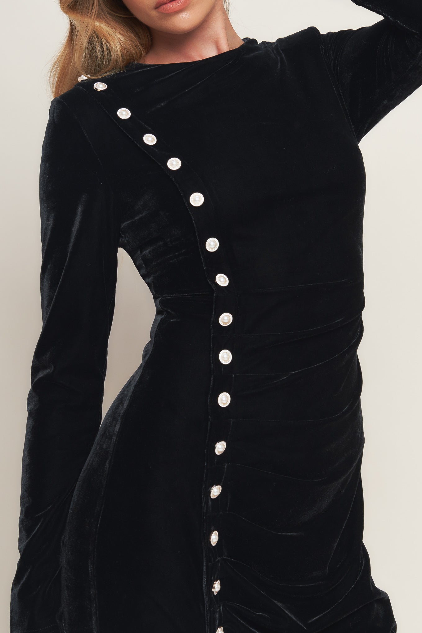 A solid velvet midi dress featuring round neckline long sleeve, side pearl button down and back zipper closure