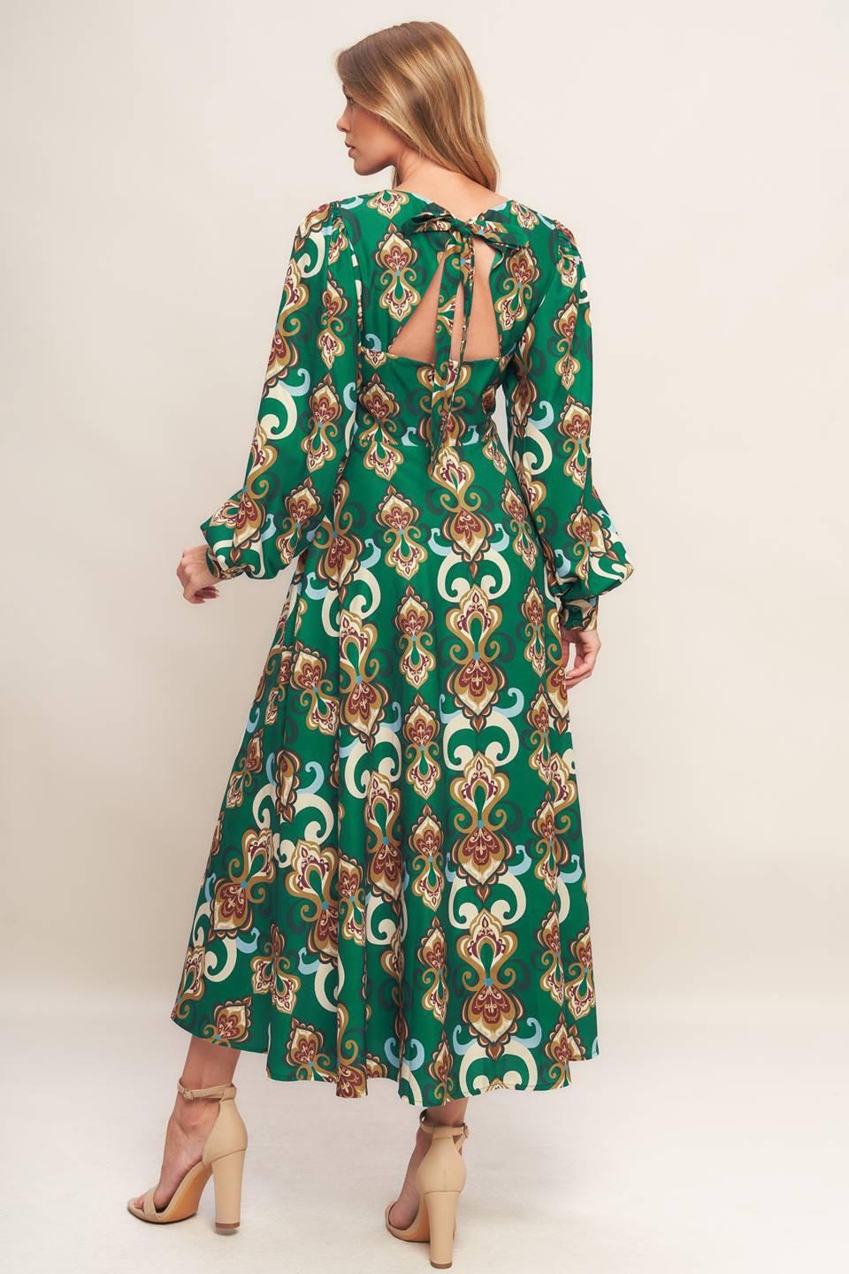 A printed woven midi dress featuring round neckline, long sleeve with cuff, circle skirt, back cut out with tie and zipper closure