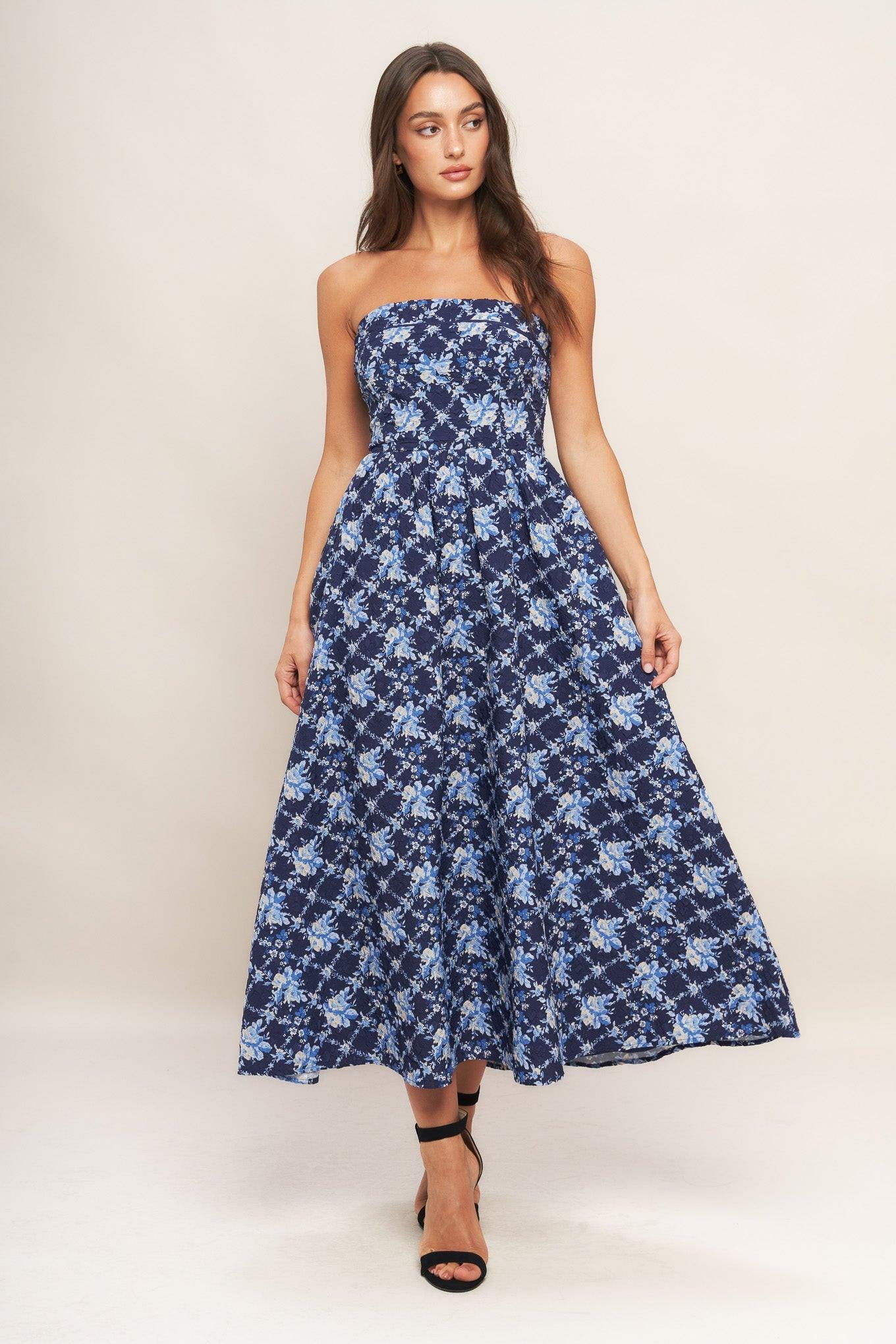 A textured woven midi dress featuring strapless, full skirt and smocked back bodices