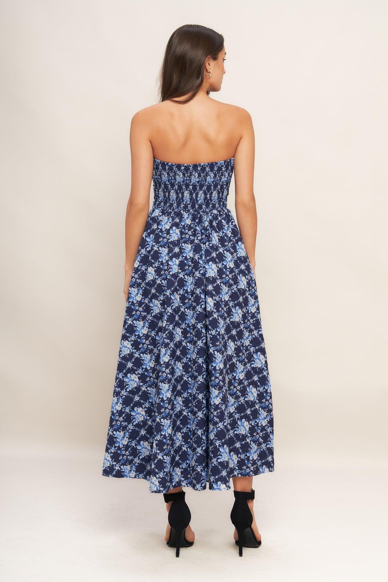 A textured woven midi dress featuring strapless, full skirt and smocked back bodices