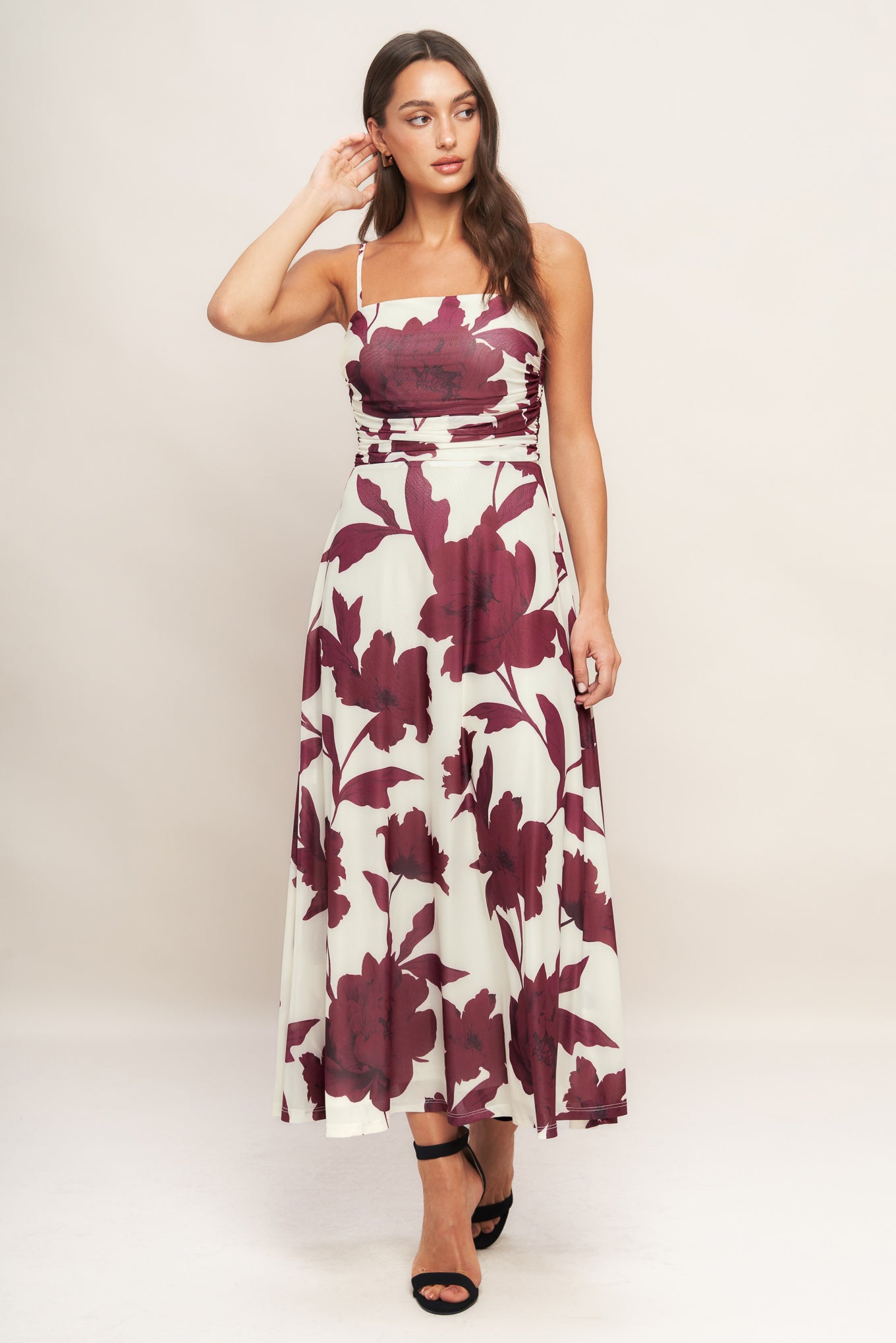 A printed power mesh midi dress featuring straight neckline, straps, side shirred bodice, circle skirt and back zipper closure