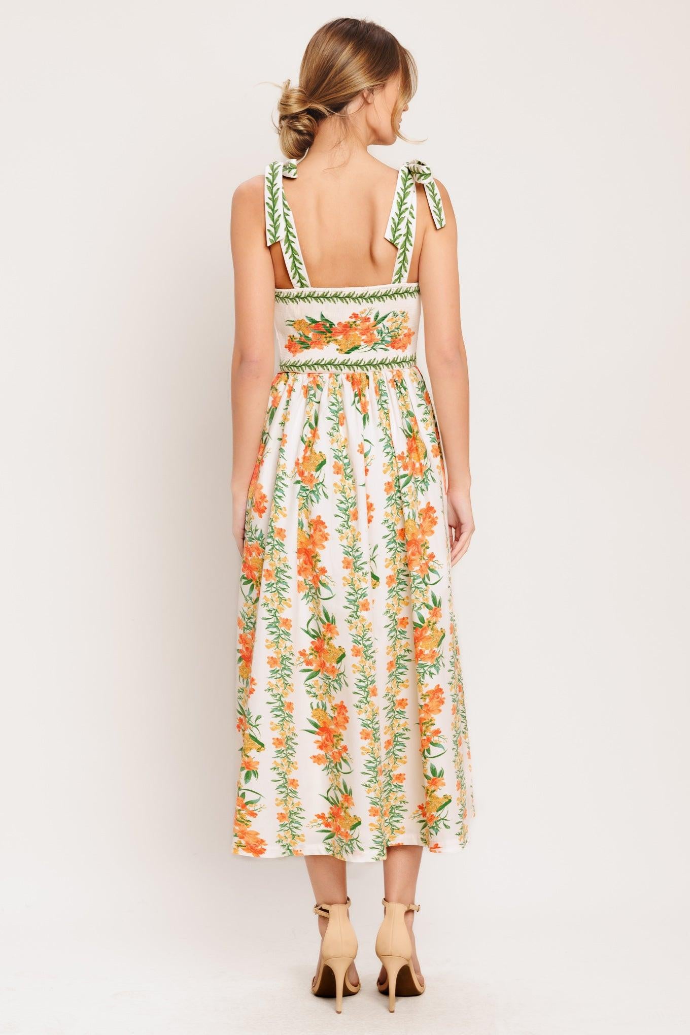 A printed woven midi dress featuring straight neckline, shoulder ties, full skirt and smocked back bodice
Details:
Self: 100% Polyester
Lining: 100% Polyester
Size & Fit
-Model is 5`8" And Wearing Size Small
-Measurements Taken From Size Small
-Approx. Length: 51"