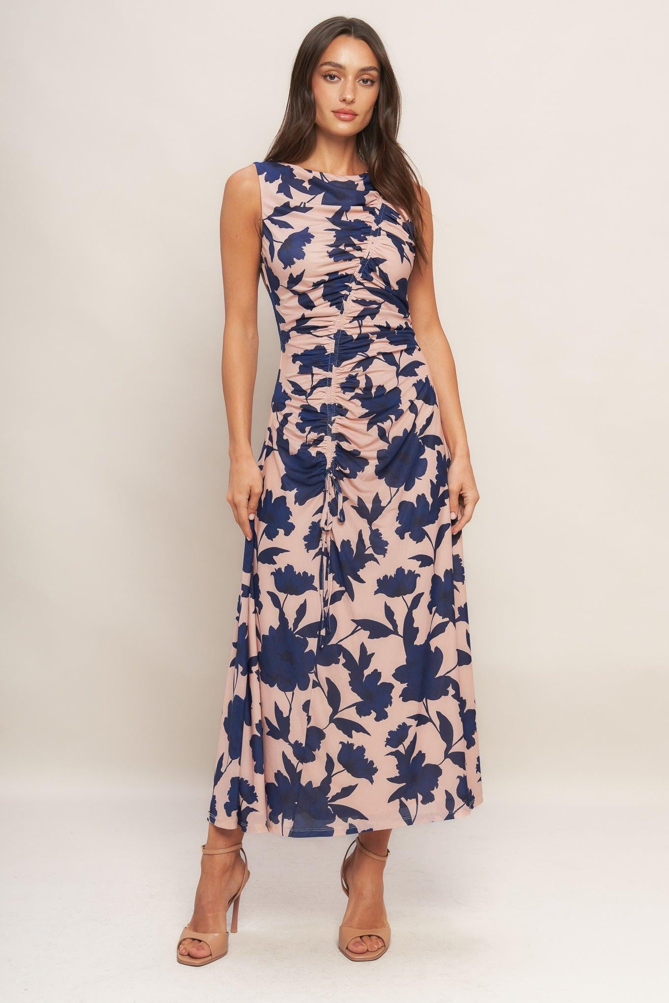 A printed power mesh midi dress featuring boat neckline, sleeveless, shirred body and back zipper closure