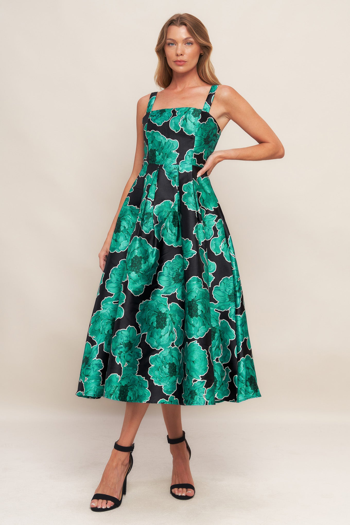 A printed woven midi dress featuring straight neckline, straps, full skirt and back zipper closure