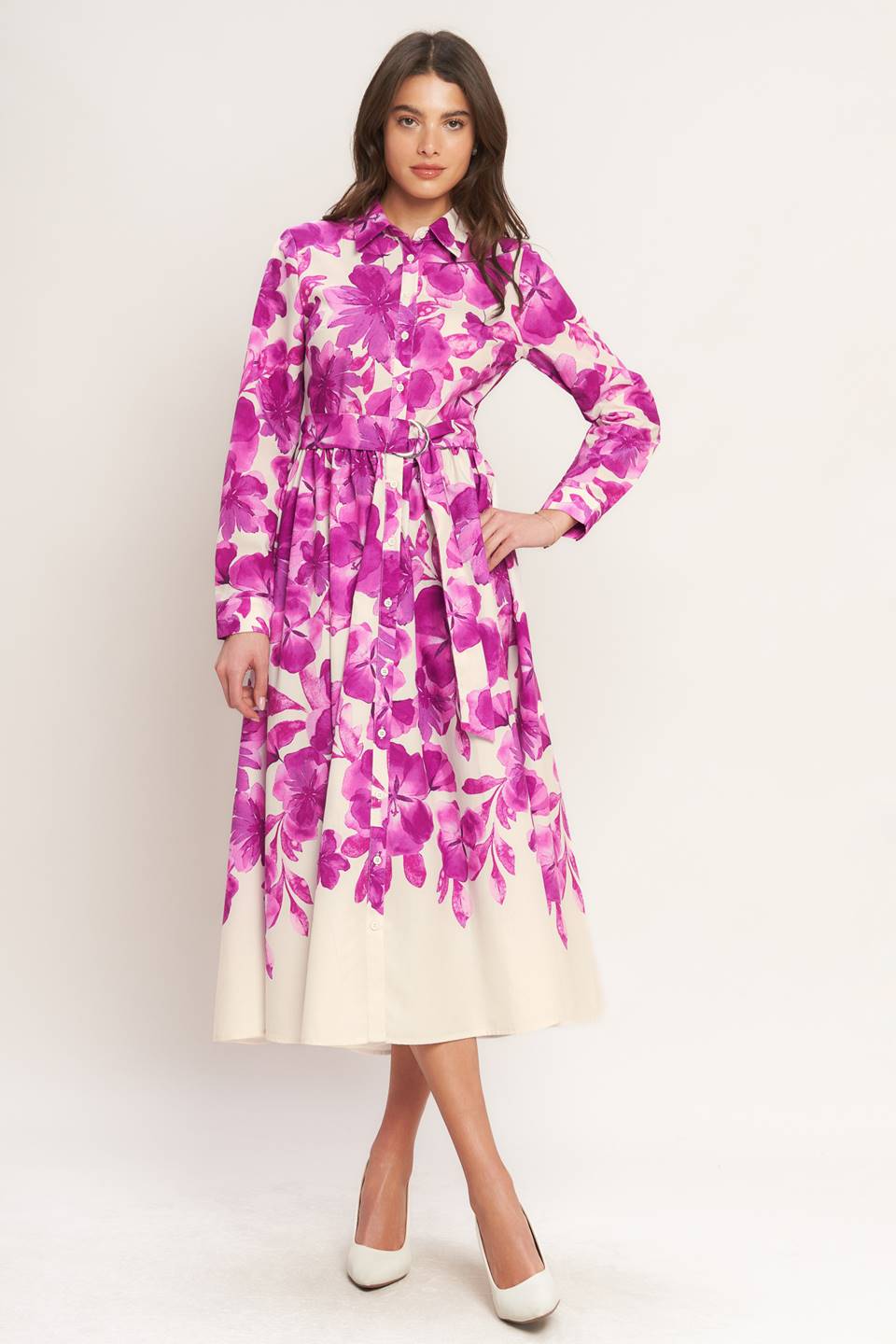 A woman wearing a long-sleeve midi dress with a fuchsia and cream floral print | Flying Tomato