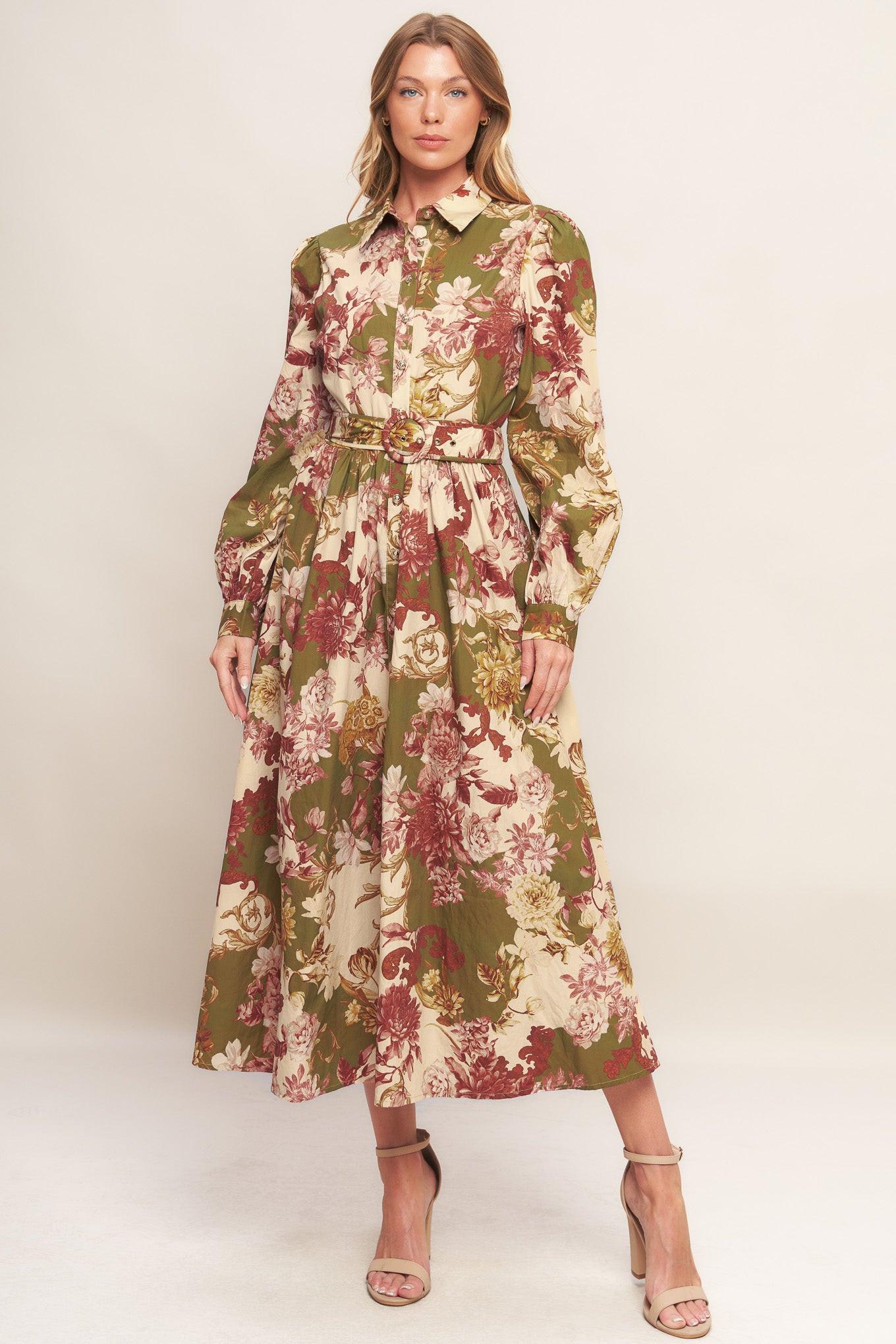 A printed woven midi dress featuring collar, long sleeve with cuff, front button down closure, self belt and full skirt