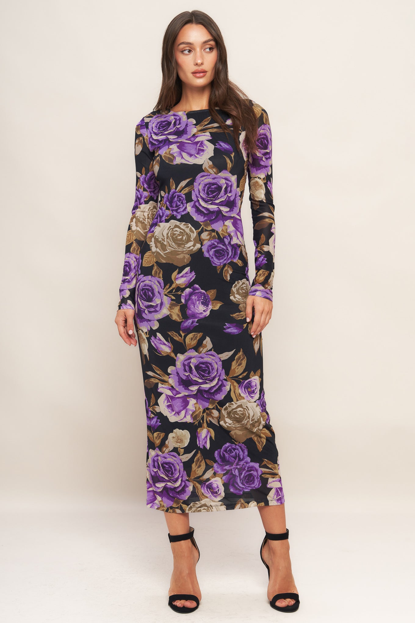 A printed power mesh midi dress featuring body contouring, round neckline, long sleeve and back neck button closure