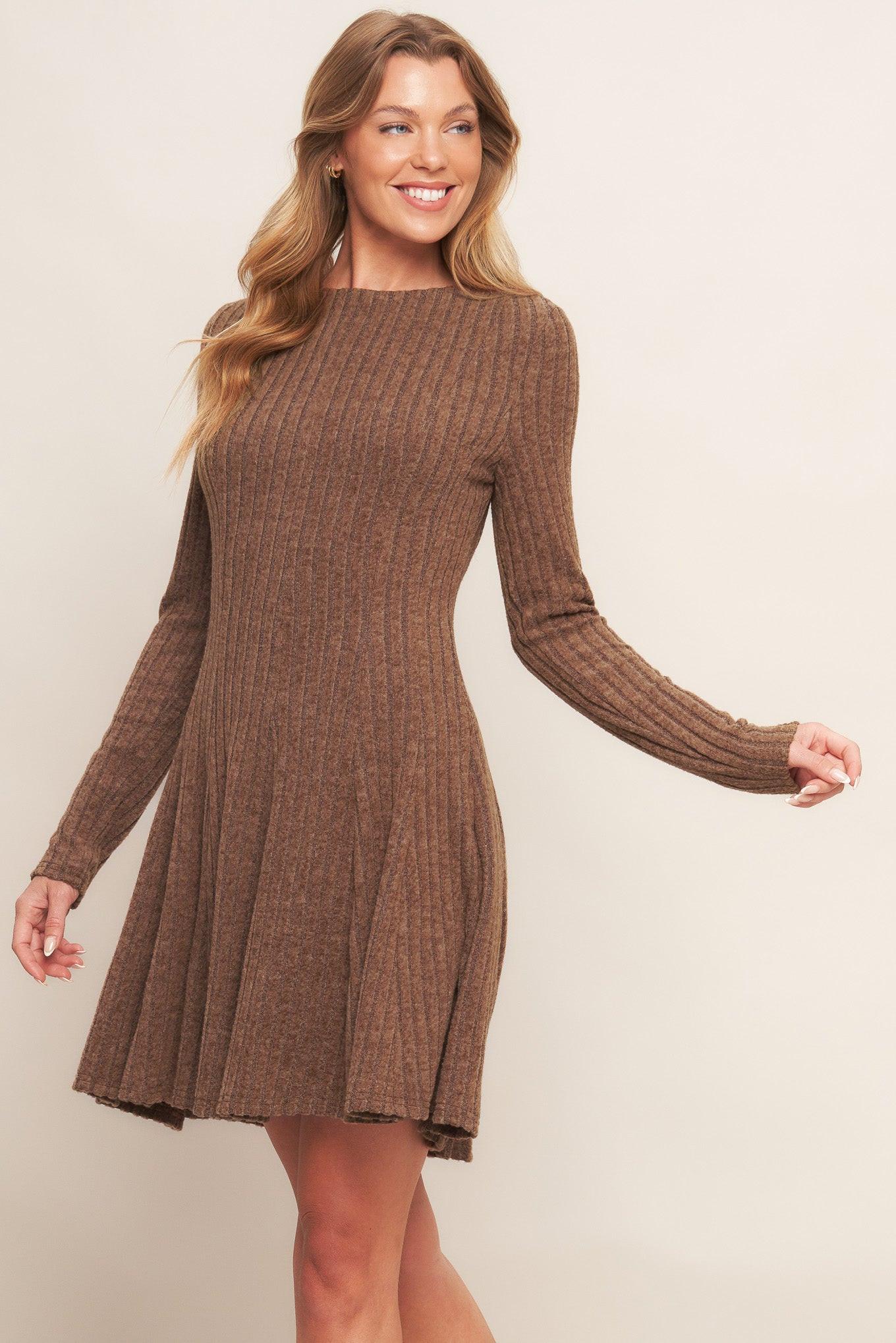 A brushed ribbed knit mini dress featuring round neckline, long sleeve, circle skirt and back zipper closure