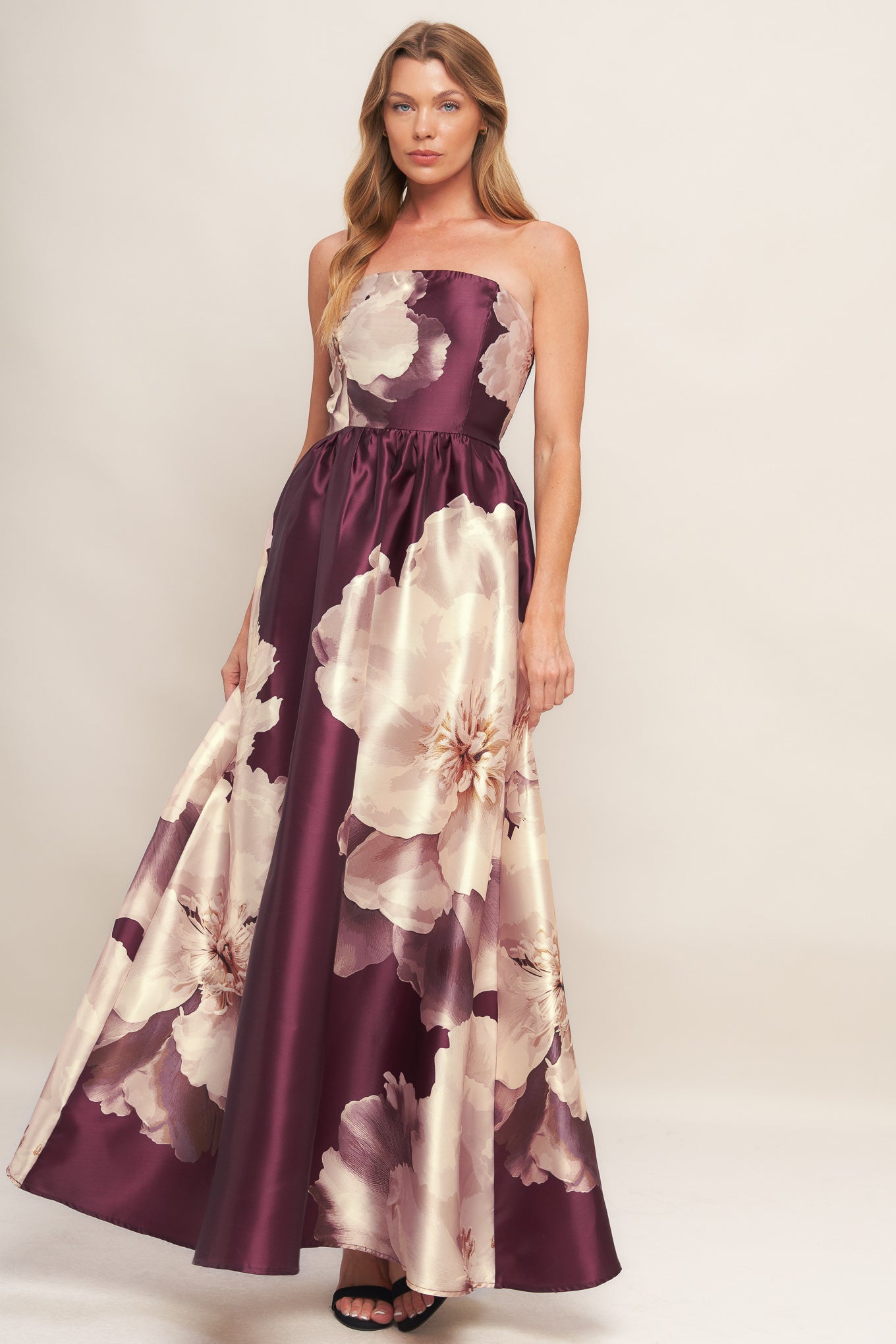 A printed woven maxi dress featuring strapless neckline, full skirt and smocked back bodice
