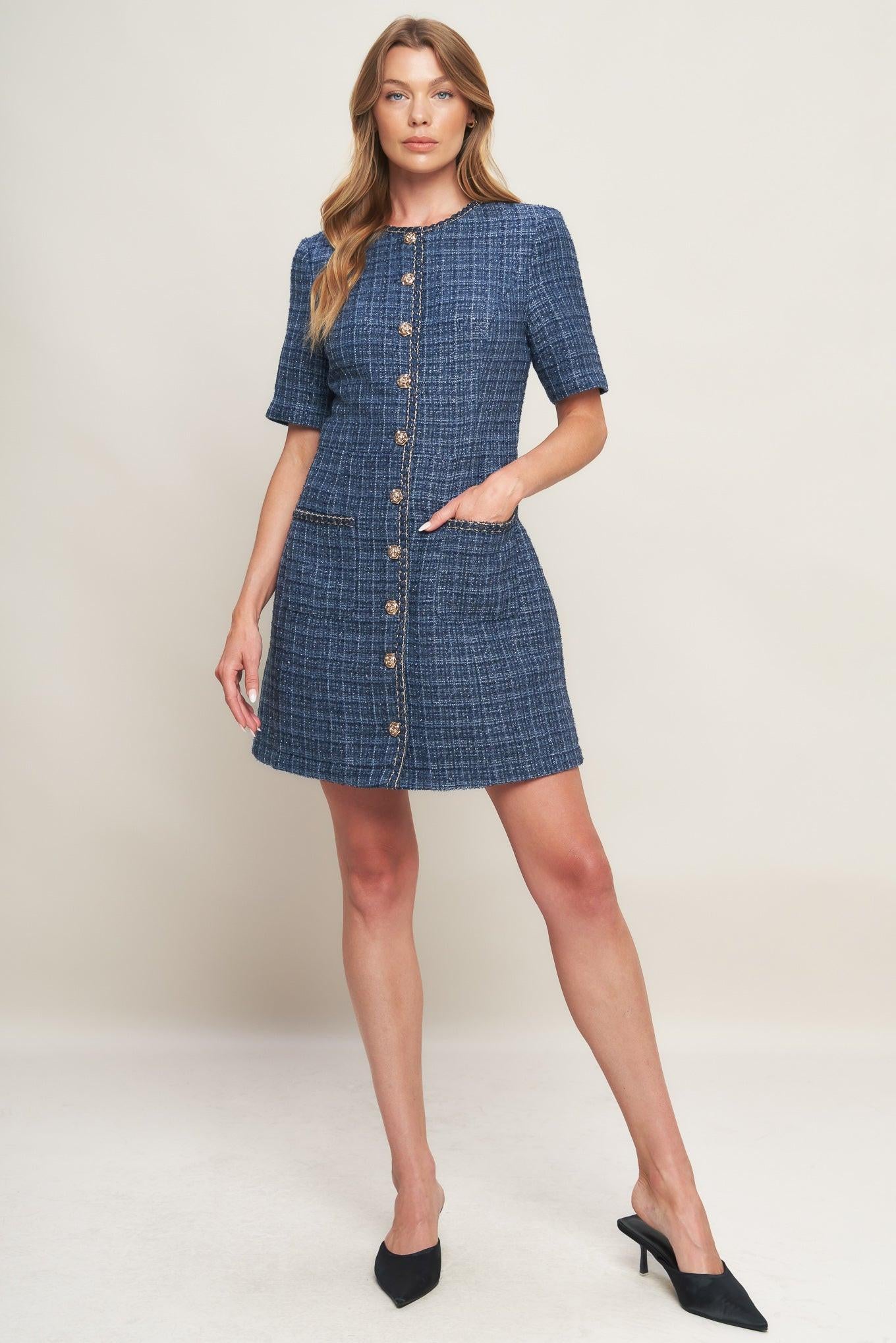 A tweed mini dress featuring round neckline, short sleeve, front button down with chain trimmed edge and pockets
