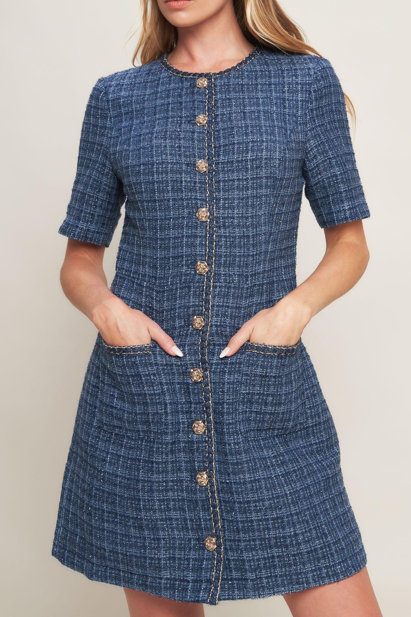 A tweed mini dress featuring round neckline, short sleeve, front button down with chain trimmed edge and pockets