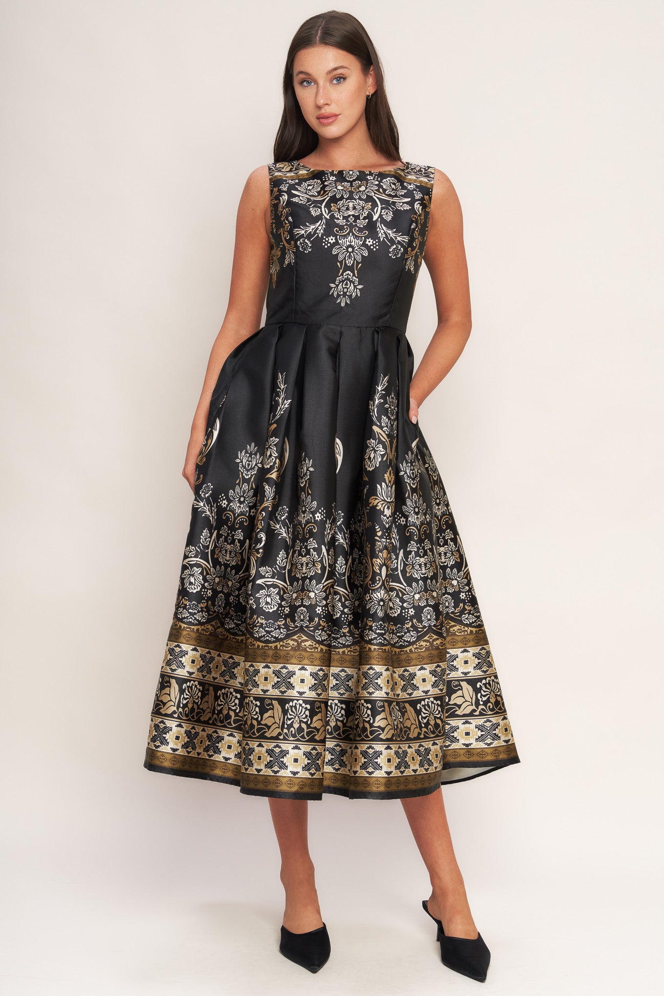 A printed woven midi dress featuring round neckline, sleeveless, full skirt and back zipper closure