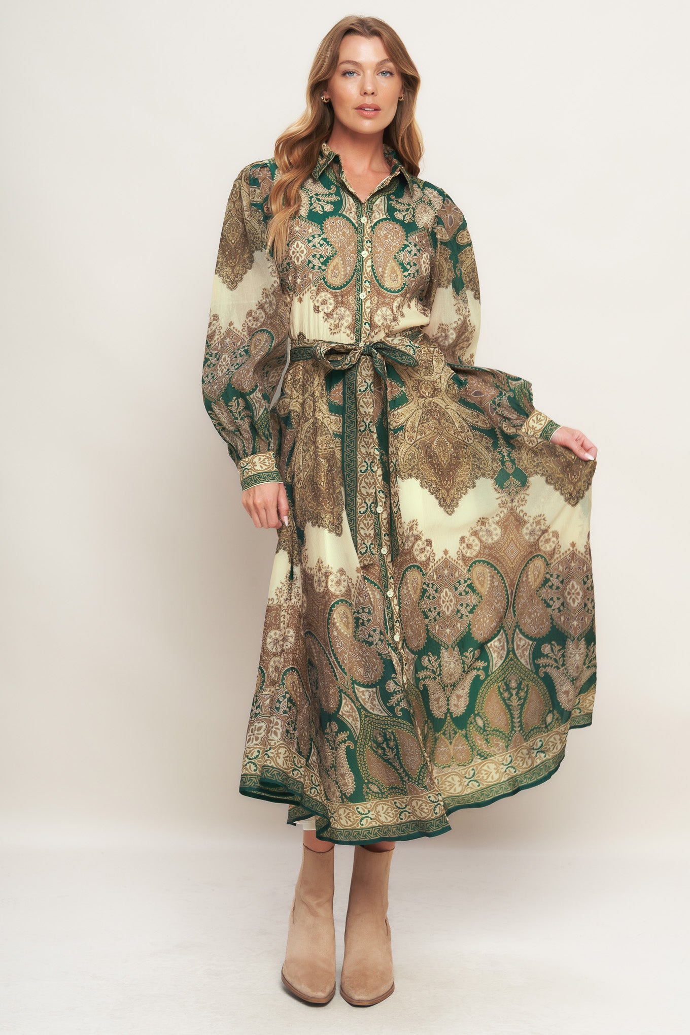 A printed woven midi dress featuring collar, front button down closure, long sleeve with cuff and circle skirt