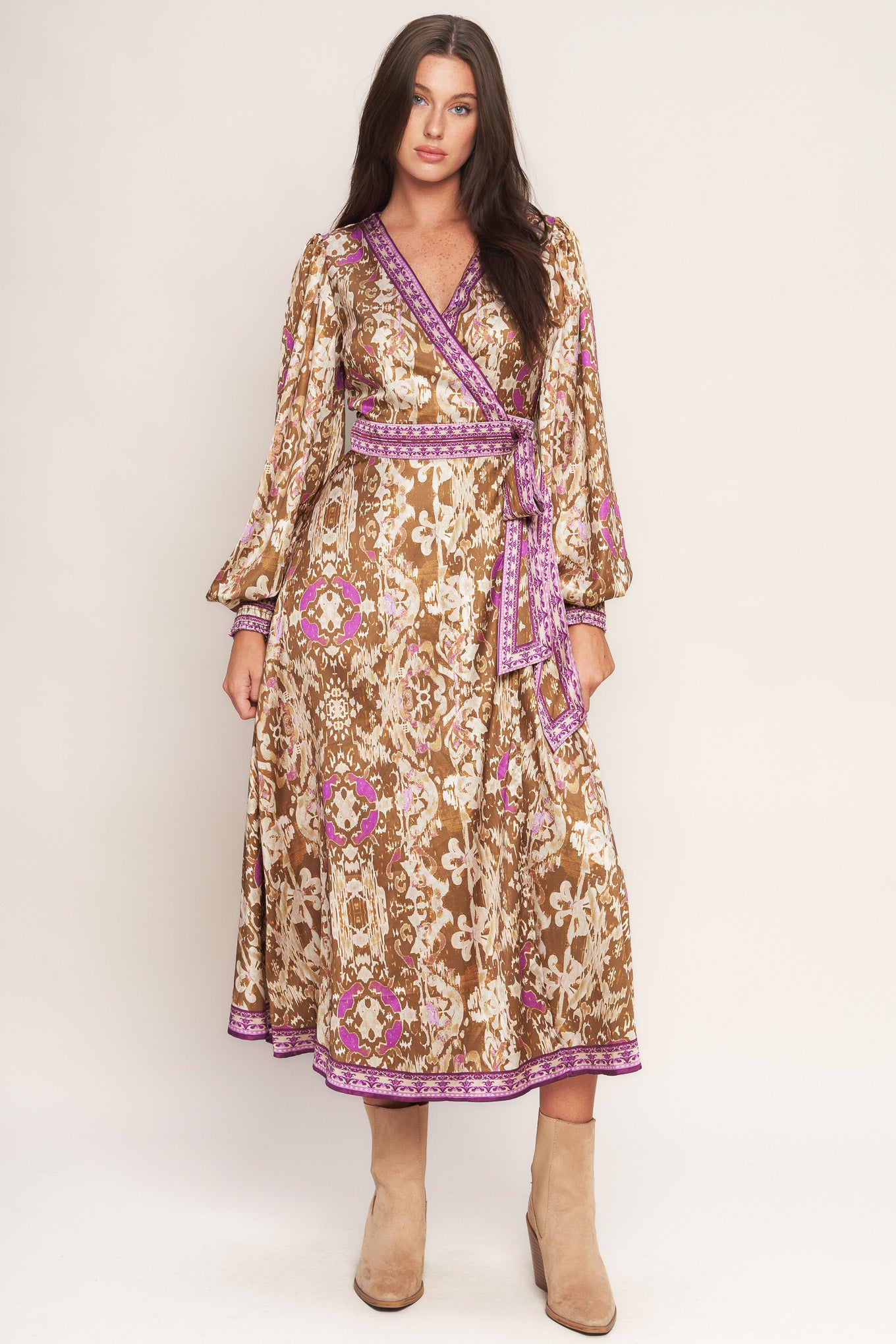 A printed woven midi true wrap dress featuring surplice neckline and long sleeve with smocked cuff