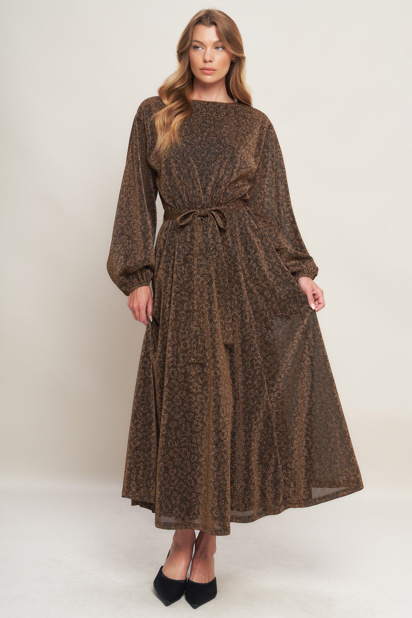 A metallic threaded woven midi dress featuring wide neckline, long blouson sleeve, self sash tie and back zipper closure