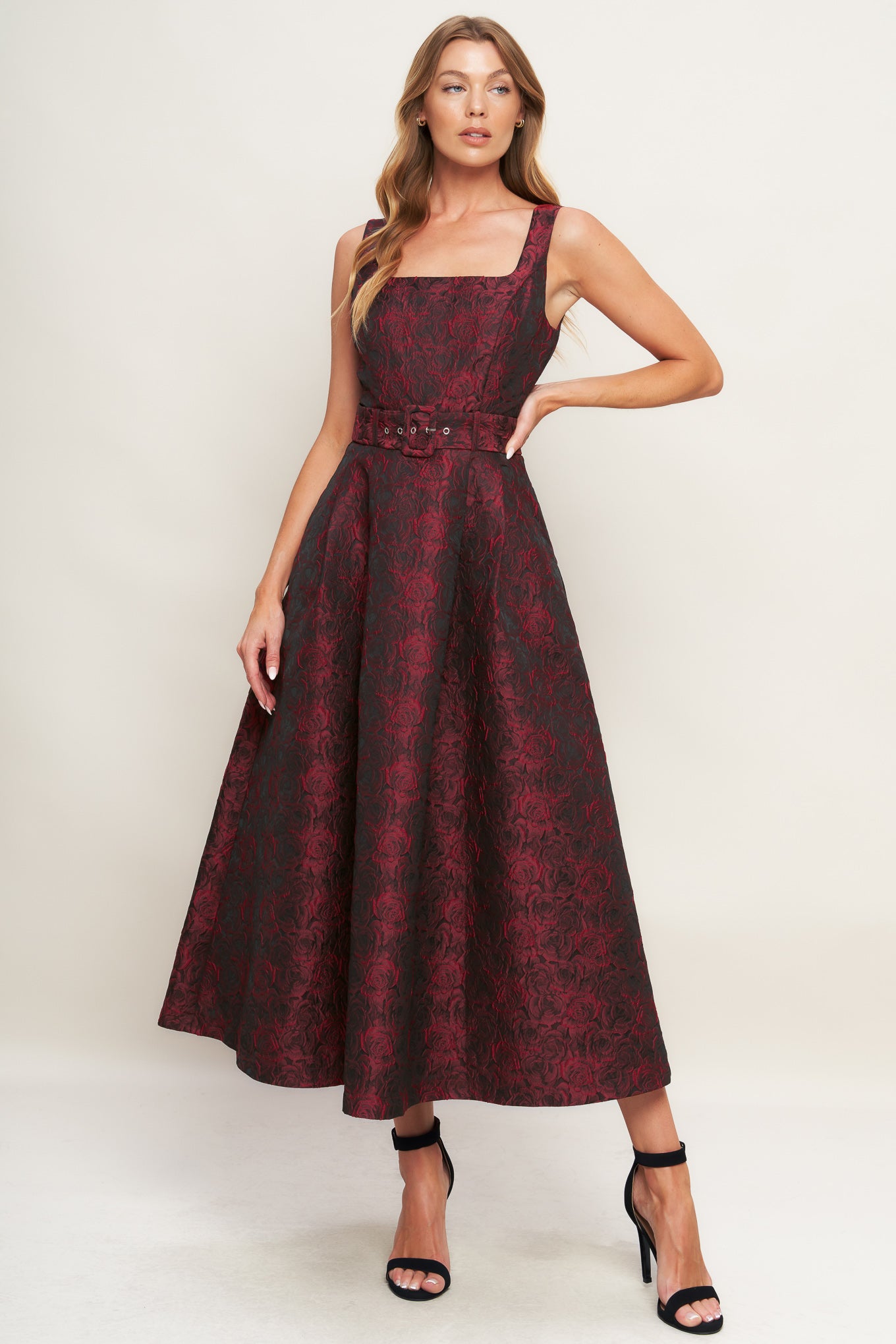 A woven jacquard midi dress featuring square neckline, sleeveless, self belt, full skirt and back zipper closure