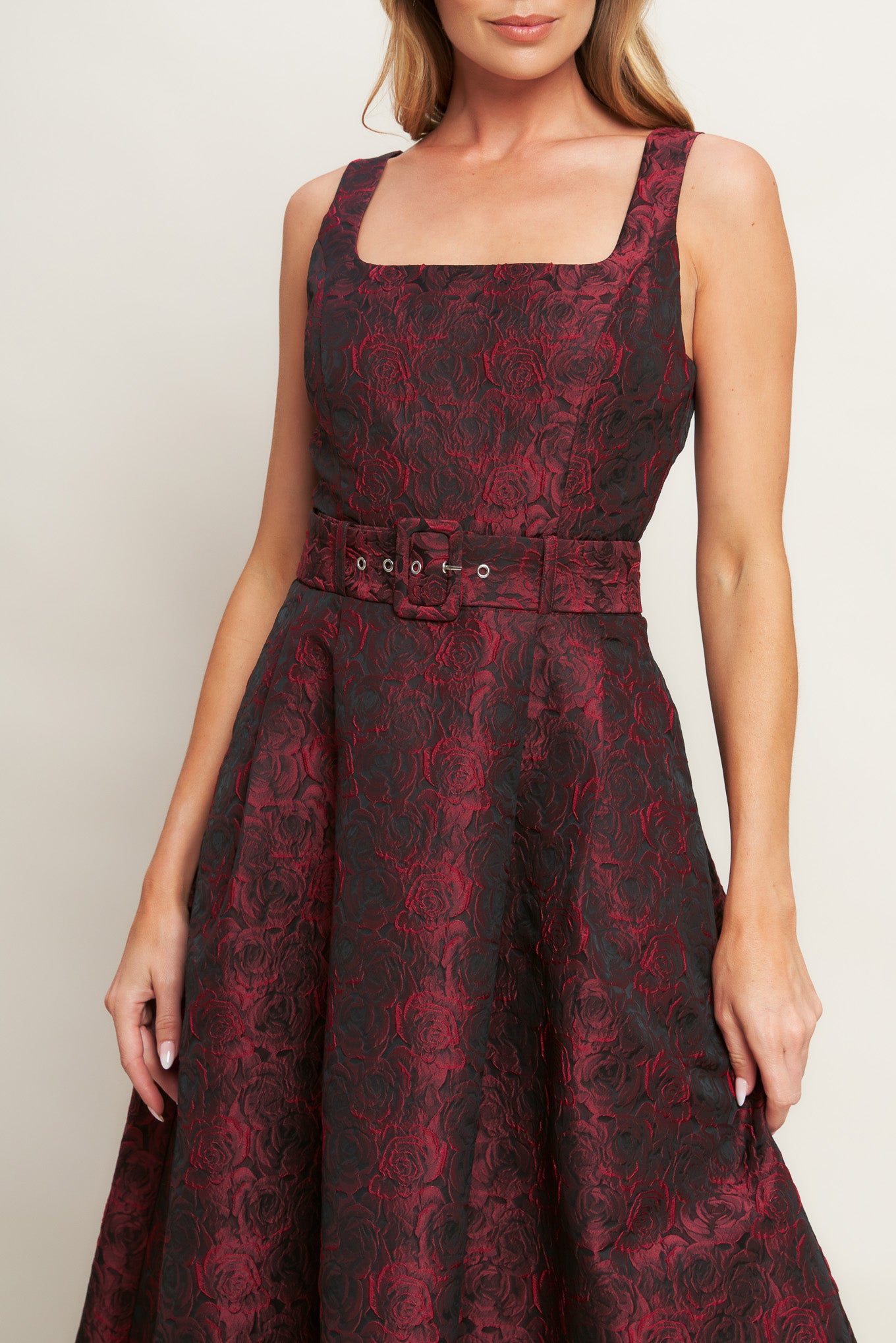 A woven jacquard midi dress featuring square neckline, sleeveless, self belt, full skirt and back zipper closure