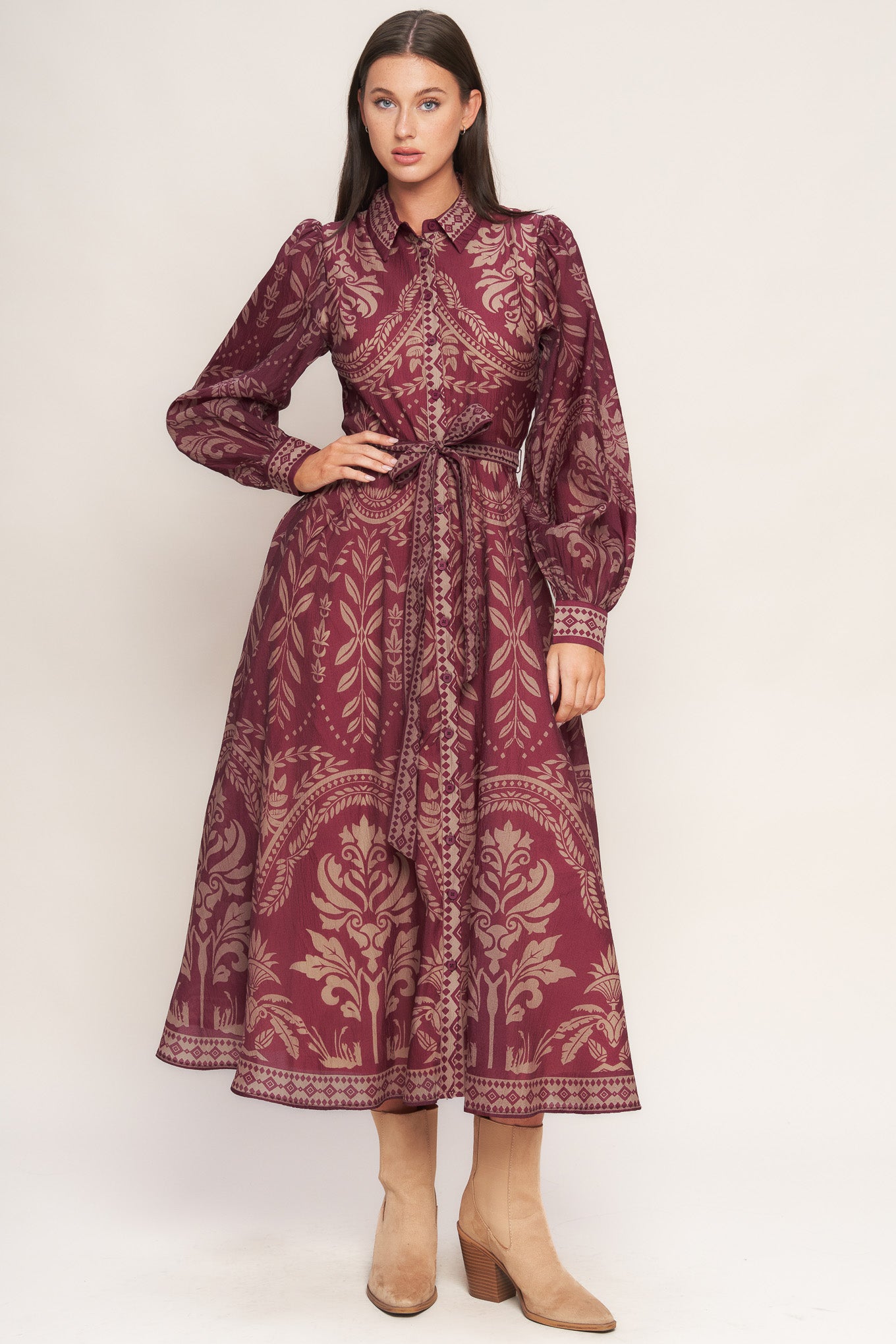 A printed woven midi dress featuring collar, front button down closure, long sleeve with circle skirt