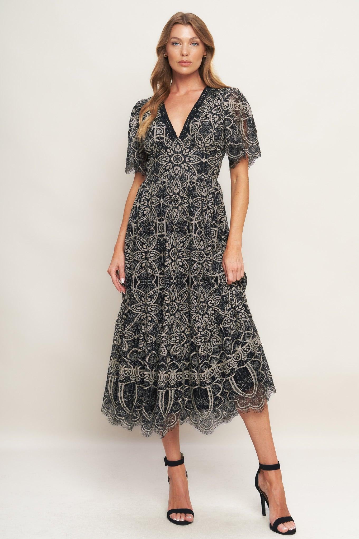A woven lace midi dress featuring V neckline with lace trim, short sleeve, waist yoke and back zipper closure