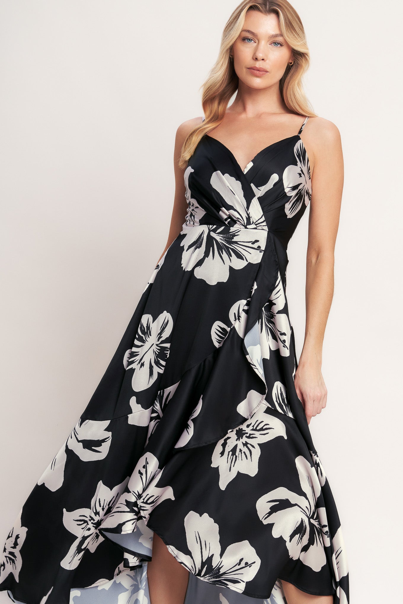 A printed woven maxi dress featuring surplice cami top, faux wrap with ruffle hem and back zipper closure
Details:
Self: 100% Polyester
Lining: 100% Polyester
Size & Fit
- Model is 5`8" And Wearing Size Small
- Measurements Taken From Size Small
- Approx. Length: 59"