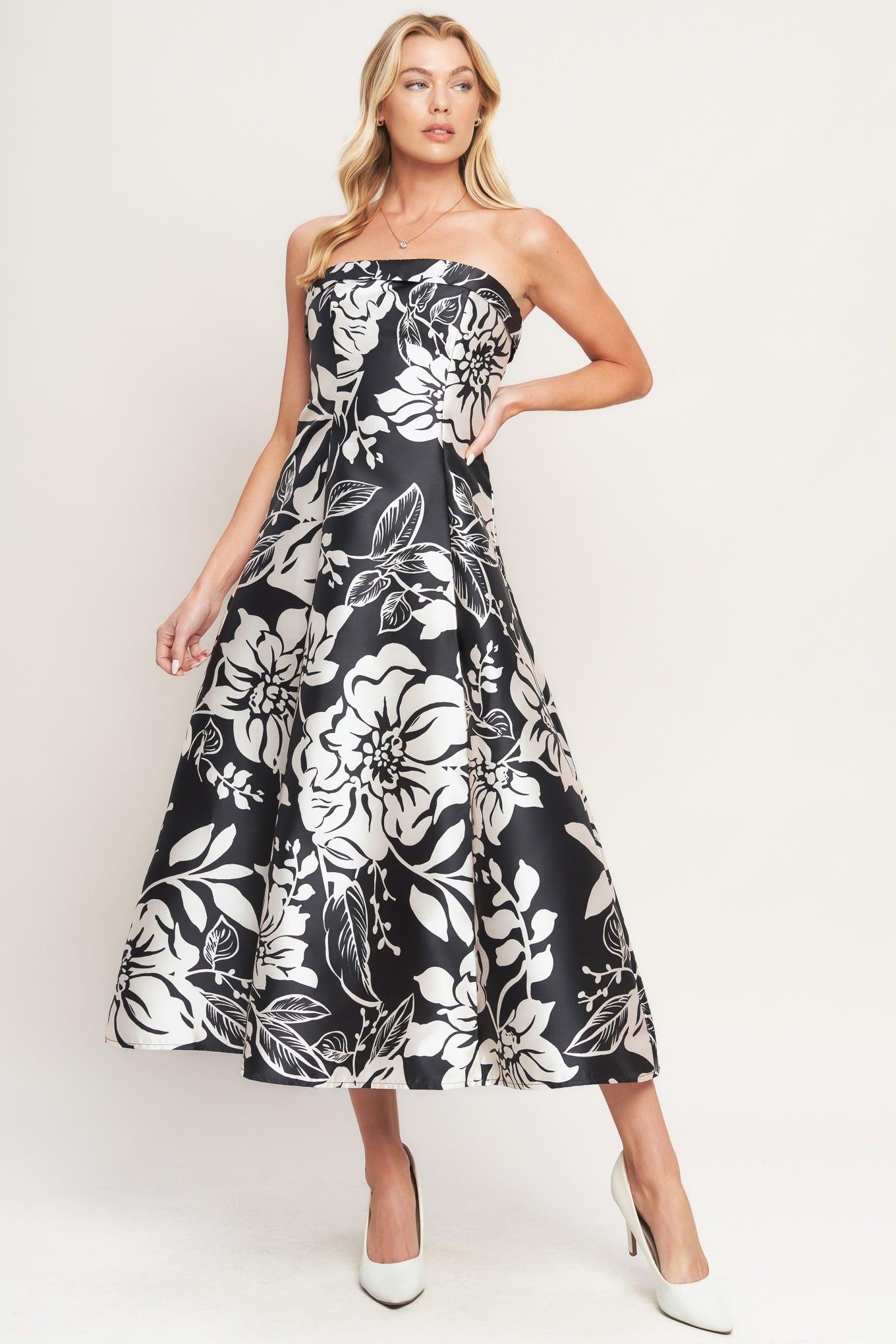A printed woven midi dress featuring straight neckline, circle skirt and back zipper closure